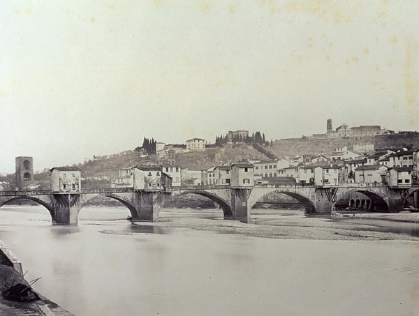 The Ponte alle Grazie'. Over a dry Arno, with large weirs. In the background the town and hills of San Miniato