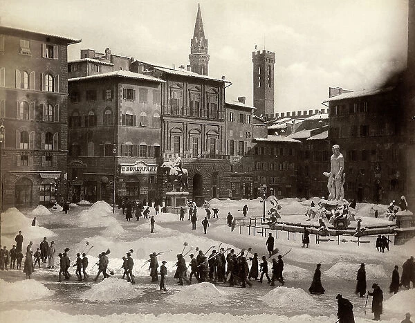 Snow shovellers in Piazza della Signoria in Florence after an exceptional snowfall