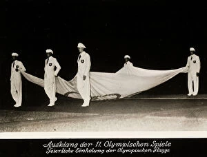 Images Dated 12th June 2008: 1936 Berlin Olympic Games: five men carry a banner with the insignia of the games