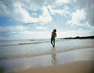 Images Dated 31st March 2010: An Aborigine and his fishing harpoon on the shore of the Arafura Sea, Arnhem Land, Australia