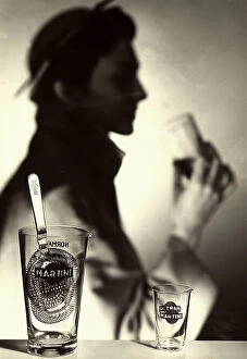 Images Dated 30th January 2007: Advertisement for 'Martini' vermouth. In the foreground is are two empty glasses bearing