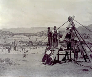 Images Dated 2nd November 2011: Archaic cableway used to ord a river in the argentine mountains. In the foreground some men