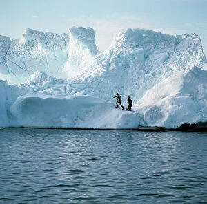 Images Dated 13th June 2008: The artificers of the ice-patrol, ready to mine an iceberg, dangerous for navigation in Disko Bay