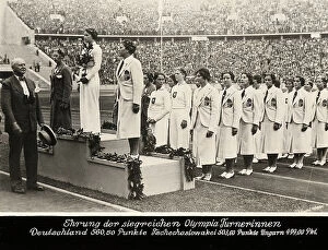 Images Dated 12th June 2008: Awarding of young female gymnasts, 1936 Berlin Olympic Games