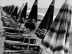 Images Dated 11th April 2011: Beach umbrellas and lawn chairs closed on a beach