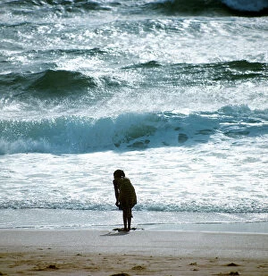 Images Dated 17th November 2009: Big ocean waves and a figure on the beach