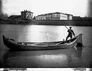Florence Collection: A boatman (Renaiolo) on the Arno River in Florence