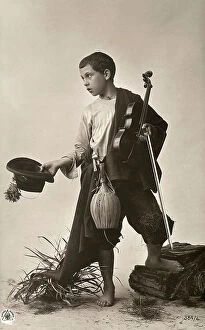 Images Dated 4th May 2011: Boy dressed as traveling musician