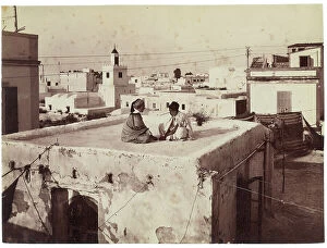Images Dated 26th November 2007: Boys on the roof of a house, Tunis