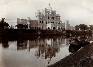 Images Dated 30th November 2011: The building of the Chhatar Manzil reflected on the waters of a river, Lucknow, India