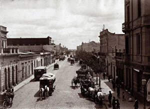 August Collection: Carriages and tram on a street in Buenos Aires, Argentina