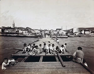 Images Dated 25th July 2005: Children siting on the pier at the port of Isola in Slovenia