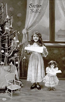 Images Dated 19th September 2008: Christmas postcard. At the center of the image a small girl in an elegant lace dress is posing