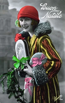 Images Dated 19th September 2008: Christmas postcard of a young woman in multi-colored winter clothes