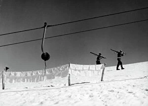 Images Dated 28th November 2011: Clothes hanging on the snow and men on foot