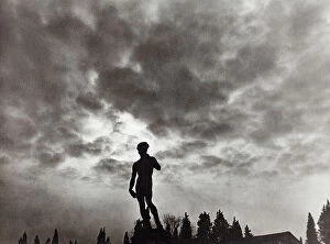 Florence Collection: The copy of David by Michelangelo photographed against the backdrop of a cloudy sky