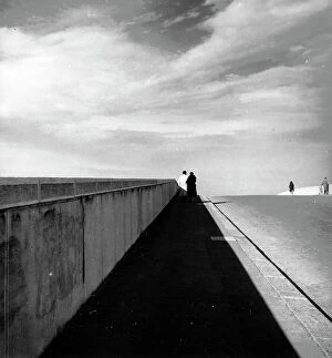 : Couple walking on a bridge