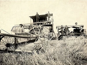 Images Dated 18th April 2011: Farmers posing in a field next to a threshing machine