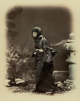 Images Dated 29th July 2011: Full-length portrait of a young japanese woman. She wears a traditional winter costume complete