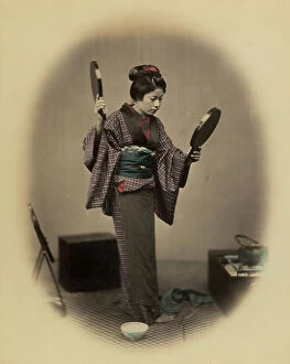 Images Dated 29th July 2011: Full-length portrait of a young japanese woman in traditional clothes