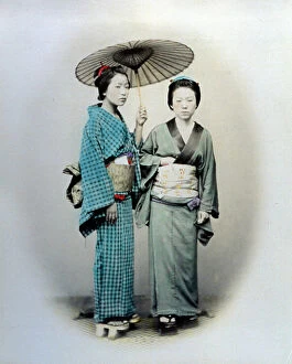 Images Dated 4th March 2010: Full-length portrait of two young japanese women. The pretty girls are wearing the traditional