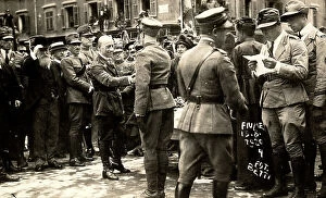 Images Dated 11th May 2011: Gabriele D'Annunzio shakes hands with a soldier, in a road of Fiume; around him