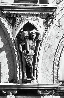 Images Dated 12th April 2010: Gargoyles, human figures that are holding up wineskins, north facade, Basilica of San Marco, Venice