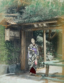 Images Dated 28th November 2011: Geisha wearing a Kimono posing under an arbour