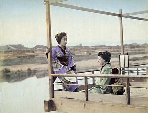 Images Dated 28th November 2011: Two geishas wearing kimonos on a terrace