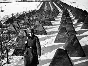 Images Dated 2nd December 2010: German soldier crosses reinforced concrete barrage