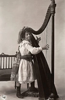 Images Dated 26th August 2009: Girl photographed with a harp