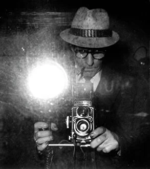 Images Dated 26th November 2009: Giuseppe Borra takes a picture of himself with a Rolleiflex, in front of a mirror