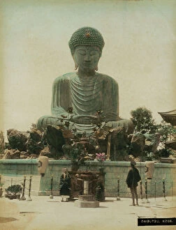 Japan: The great statue of Buddha at Kobe, in Japan. In the foreground, at the center of the picture