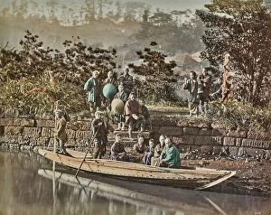 Japan: A group of Japanese with a typical wooden boat