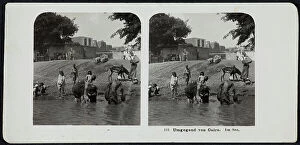 Images Dated 15th November 2011: Group of persons shown getting water in the river, in the outskirts of Cairo