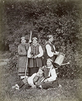 Images Dated 16th May 2011: Group of young Ukrainian gardeners in a field. In the foreground two are seated on the grass