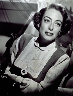 Images Dated 24th September 2008: Half-length portrait of the actress Joan Crawford. She is almost smiling and looking elsewhere