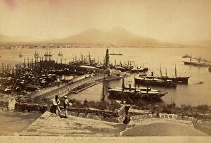 Images Dated 15th June 2010: The harbor of Naples with numerous ships at anchor. In the foreground two men conversing at