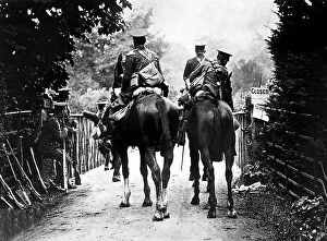 Images Dated 19th March 2009: The image shows a group of English soldiers on horseback, portrayed from behind along the road