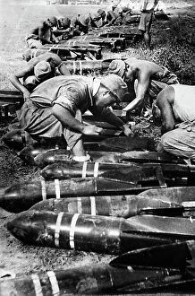 Images Dated 3rd November 2011: Inspection of aircraft bombs by Italian soldiers during WWII