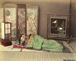 Japan: Two Japanese girls sleeping on the floor of a bedroom with typical Japanese furnishings