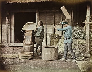 Japan: Two Japanese peasants working on straw