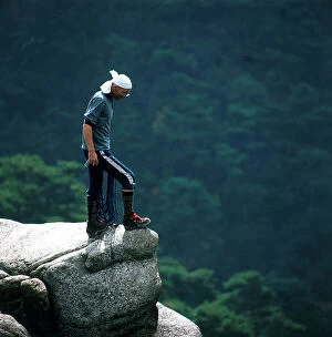 Japan: Kobe. Mountaineering monk among the woods and rocks to the north of Kobe