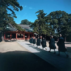 Images Dated 30th October 2009: Kobe. Zen Shofukuji Monastery. Monks going out in early morning to beg for alms in the city