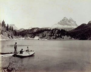 Images Dated 15th March 2010: The Lake of Misurina. In the foreground, two boats near the shore with three men on board