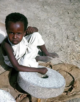 Images Dated 17th November 2009: Lower Juba. In a village an ancient grindstone for corn, the stone still working