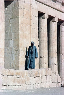 Images Dated 31st October 2011: Luxor Deir el-Bahri, a man between the columns of the funerary temple of Queen Ashepsut