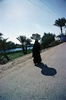 Images Dated 12th October 2011: Luxor in Upper Egypt, women are returning on the ferry, from the market