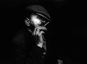 Images Dated 23rd March 2009: 'Mafia'. Portrait of a man with a cigarette and a cap