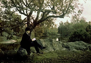 Images Dated 12th February 2010: Man reading a book in Fontainebleau forest